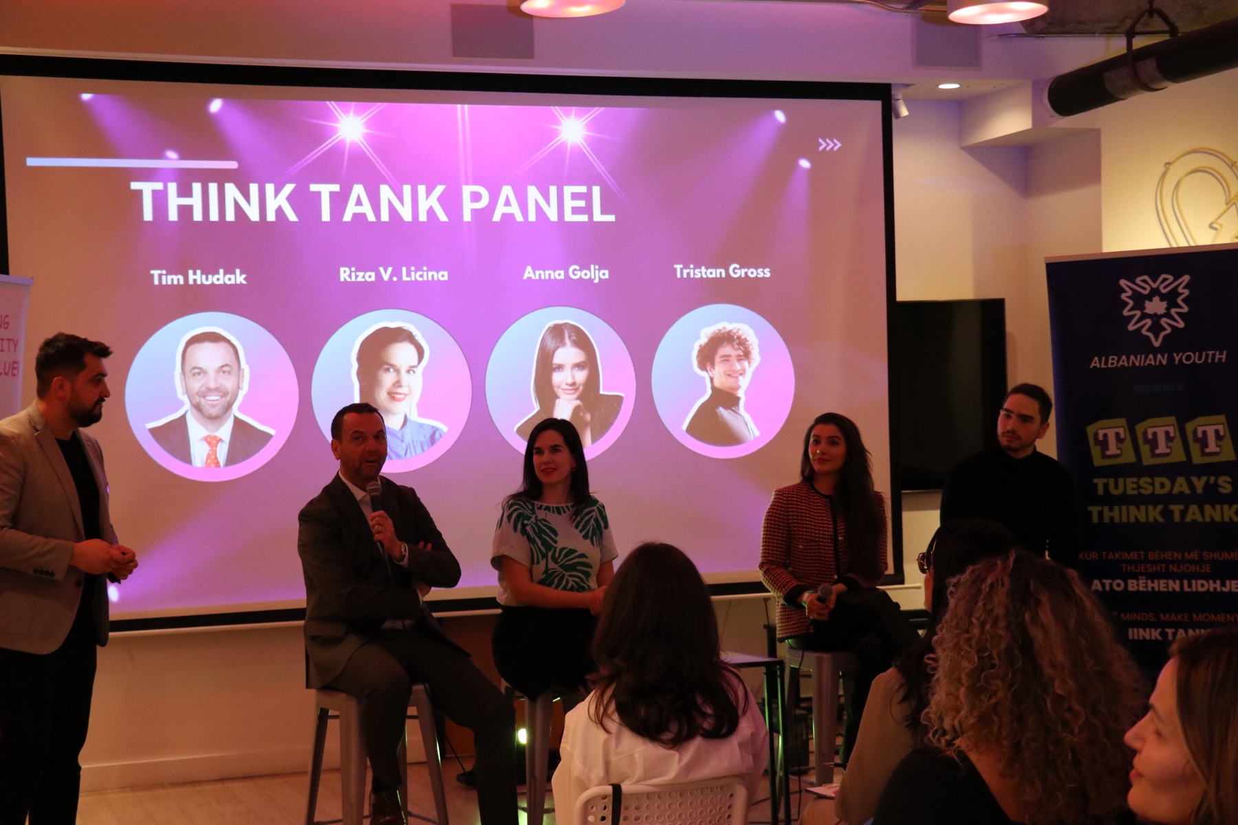 Business speakers taking part in a think-tank panel organized by the team